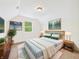 Bedroom featuring large bed, side tables, and decor art at 907 S A St, Elwood, IN 46036