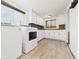 The laundry room is equipped with modern appliances, offering efficiency at 907 S A St, Elwood, IN 46036