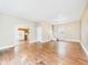 Spacious living room featuring hardwood floors, neutral walls, and an open layout at 907 S A St, Elwood, IN 46036