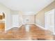 Spacious living room featuring hardwood floors, neutral walls, and an open layout at 907 S A St, Elwood, IN 46036