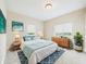 A stylish bedroom features calming decor, natural light, and wooden accents at 907 S A St, Elwood, IN 46036