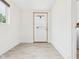 A simple mud room features a practical entrance to a home at 907 S A St, Elwood, IN 46036