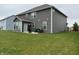 A spacious backyard features a well-maintained lawn and the rear of a two-story home at 9133 Thames Dr, Avon, IN 46123
