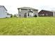 A spacious backyard features a well-maintained lawn and the rear of a two-story home at 9133 Thames Dr, Avon, IN 46123