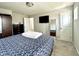 Cozy bedroom with soft carpet, a tv, and closet space for a relaxing retreat at 9133 Thames Dr, Avon, IN 46123