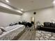 Versatile bedroom provides flexible space with a comfortable bed, chair and good natural light at 9133 Thames Dr, Avon, IN 46123