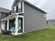 The home features a cozy front porch with seating, dark shutters, and manicured landscaping at 9133 Thames Dr, Avon, IN 46123