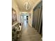 Inviting hallway features modern lighting, elegant decor, and hardwood flooring at 9133 Thames Dr, Avon, IN 46123