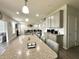 Open kitchen view of living room; perfect for entertaining with modern features at 9133 Thames Dr, Avon, IN 46123