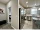 A stainless refrigerator and kitchen cabinets are seen through a doorway at 9133 Thames Dr, Avon, IN 46123