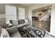 Comfortable living room with a plush gray sofa and a view into the dining area at 9133 Thames Dr, Avon, IN 46123
