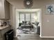 Open-concept living room viewed from kitchen; great for entertaining guests and Gathering at 9133 Thames Dr, Avon, IN 46123
