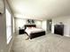 Spacious primary bedroom with plush carpeting, ample natural light, and a calming neutral palette at 9133 Thames Dr, Avon, IN 46123