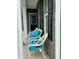 A cozy porch features comfortable seating with teal cushions, and black shutters at 9133 Thames Dr, Avon, IN 46123