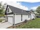 Rear of two-story white home with a black roof at 9317 E 36Th Pl, Indianapolis, IN 46235