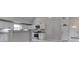 Modern kitchen with white cabinets, granite countertops, stainless steel appliances, and stylish fixtures at 9317 E 36Th Pl, Indianapolis, IN 46235