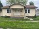 Charming single-story home with covered porch and visible street number at 1020 E 30Th St, Anderson, IN 46016