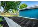 Large backyard featuring a grassy area and a garden ready for planting at 1034 N Tacoma Ave, Indianapolis, IN 46201