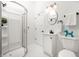Bright bathroom features a glass shower, vanity with a black faucet, and a skylight at 1034 N Tacoma Ave, Indianapolis, IN 46201