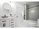 Well-lit bathroom with herringbone-patterned shower, modern vanity, and sleek fixtures at 1034 N Tacoma Ave, Indianapolis, IN 46201