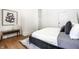 Cozy bedroom with hardwood flooring, a modern bed, and stylish decor at 1034 N Tacoma Ave, Indianapolis, IN 46201