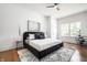Bright bedroom with hardwood flooring, a ceiling fan, large windows, and natural light at 1034 N Tacoma Ave, Indianapolis, IN 46201