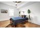 Cozy bedroom with hardwood floors, natural light, and minimalist decor at 1034 N Tacoma Ave, Indianapolis, IN 46201