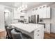 Kitchen featuring a large center island with quartz countertop and modern stainless-steel appliances at 1034 N Tacoma Ave, Indianapolis, IN 46201