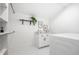 Laundry room features white appliances, cabinet storage, and trendy decor at 1034 N Tacoma Ave, Indianapolis, IN 46201