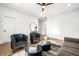 Stylish living room features hardwood floors, neutral walls, and modern black accent furniture at 1034 N Tacoma Ave, Indianapolis, IN 46201