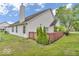 A nicely kept backyard with a wood fence and patio area adjacent to the house at 10717 Morristown Ct, Carmel, IN 46032