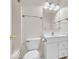 Bright bathroom with white vanity, mirror, toilet, and brushed nickel fixtures at 10717 Morristown Ct, Carmel, IN 46032