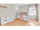 Bright bedroom with hardwood floors, loft bed, white dresser, and natural light at 10717 Morristown Ct, Carmel, IN 46032