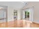 Bright living room with hardwood floors and sliding door to the deck at 10717 Morristown Ct, Carmel, IN 46032