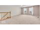 Bright loft area featuring carpet and windows that provide plenty of natural light at 10717 Morristown Ct, Carmel, IN 46032