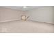 Spacious loft area with neutral carpet and stairs leading up to the second floor at 10717 Morristown Ct, Carmel, IN 46032