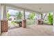 Relaxing covered front porch with brick supports and white railing, offering a cozy outdoor space at 10717 Morristown Ct, Carmel, IN 46032