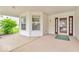 Covered porch featuring a doorway and windows, creating an inviting transition between indoors and outdoors at 10717 Morristown Ct, Carmel, IN 46032