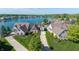 Stunning aerial shot of lakeside homes, surrounded by lush greenery and serene waters at 11065 Spice Ln, Fishers, IN 46037