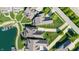 An aerial view of a neighborhood with manicured lawns, mature trees, and waterfront homes at 11065 Spice Ln, Fishers, IN 46037