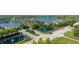 Aerial view captures the neighborhood's tree-lined streets, water features, and beautifully landscaped properties at 11065 Spice Ln, Fishers, IN 46037