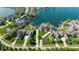 Aerial view of luxury homes, with well-manicured lawns, access to the lake, and neighborhood streets at 11065 Spice Ln, Fishers, IN 46037