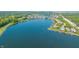 Beautiful aerial view of a lakefront property, showcasing the serene water and surrounding landscape at 11065 Spice Ln, Fishers, IN 46037