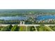Stunning aerial view of a waterfront community with lush greenery and a tranquil lake at 11065 Spice Ln, Fishers, IN 46037