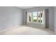 Cozy bedroom with large windows that offer a scenic view of the lake at 11065 Spice Ln, Fishers, IN 46037