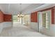 The formal dining room has large windows, tray ceiling and updated lighting fixture at 11065 Spice Ln, Fishers, IN 46037