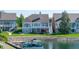 Back of home and yard featuring water access with boat and boat dock at 11065 Spice Ln, Fishers, IN 46037