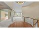 Elegant foyer with staircase leading to a spacious living area with scenic lake views at 11065 Spice Ln, Fishers, IN 46037