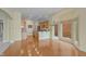 An open concept kitchen area boasts hardwood floors and lots of natural light at 11065 Spice Ln, Fishers, IN 46037