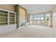 Spacious living room with custom built-ins, fireplace, and serene water views at 11065 Spice Ln, Fishers, IN 46037